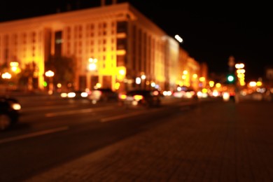 Photo of Blurred view of night cityscape with bokeh effect