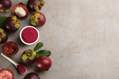 Purple mangosteen powder and fruits on light grey table, flat lay. Space for text