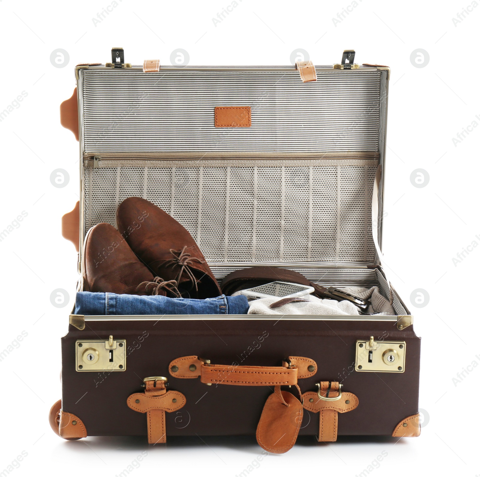 Photo of Packed suitcase with warm clothes and smartphone on white background