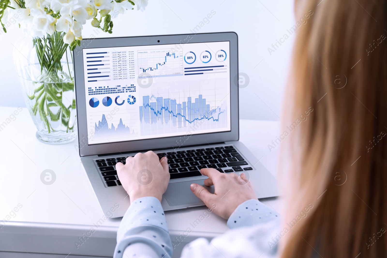 Image of Woman using laptop in office, closeup. Fintech concept