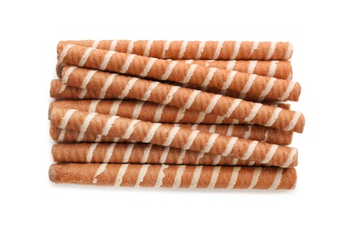 Tasty wafer roll sticks on white background, top view. Crispy food