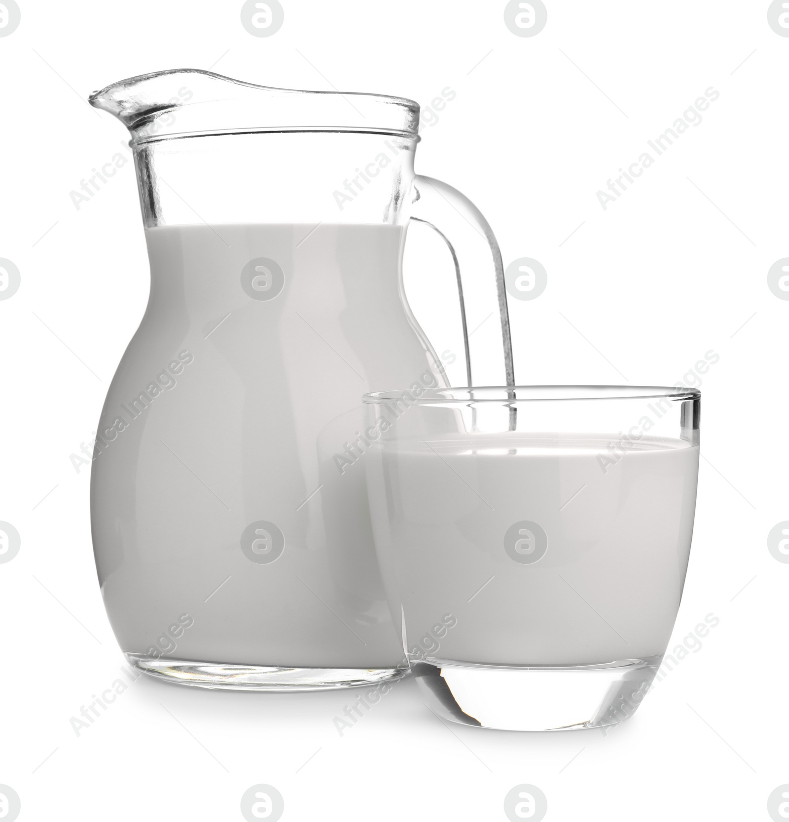 Photo of Jug and glass with fresh milk on white background