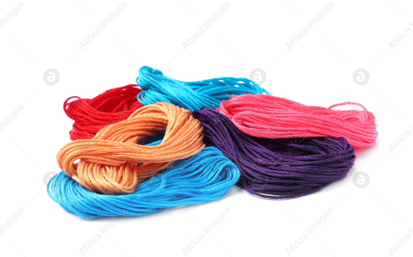 Photo of Set of colorful embroidery threads on white background