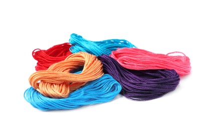 Set of colorful embroidery threads on white background