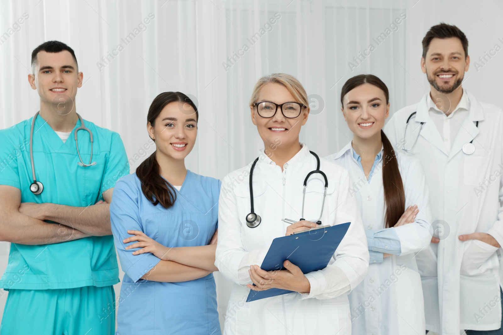 Photo of Portrait of medical doctors wearing uniforms indoors