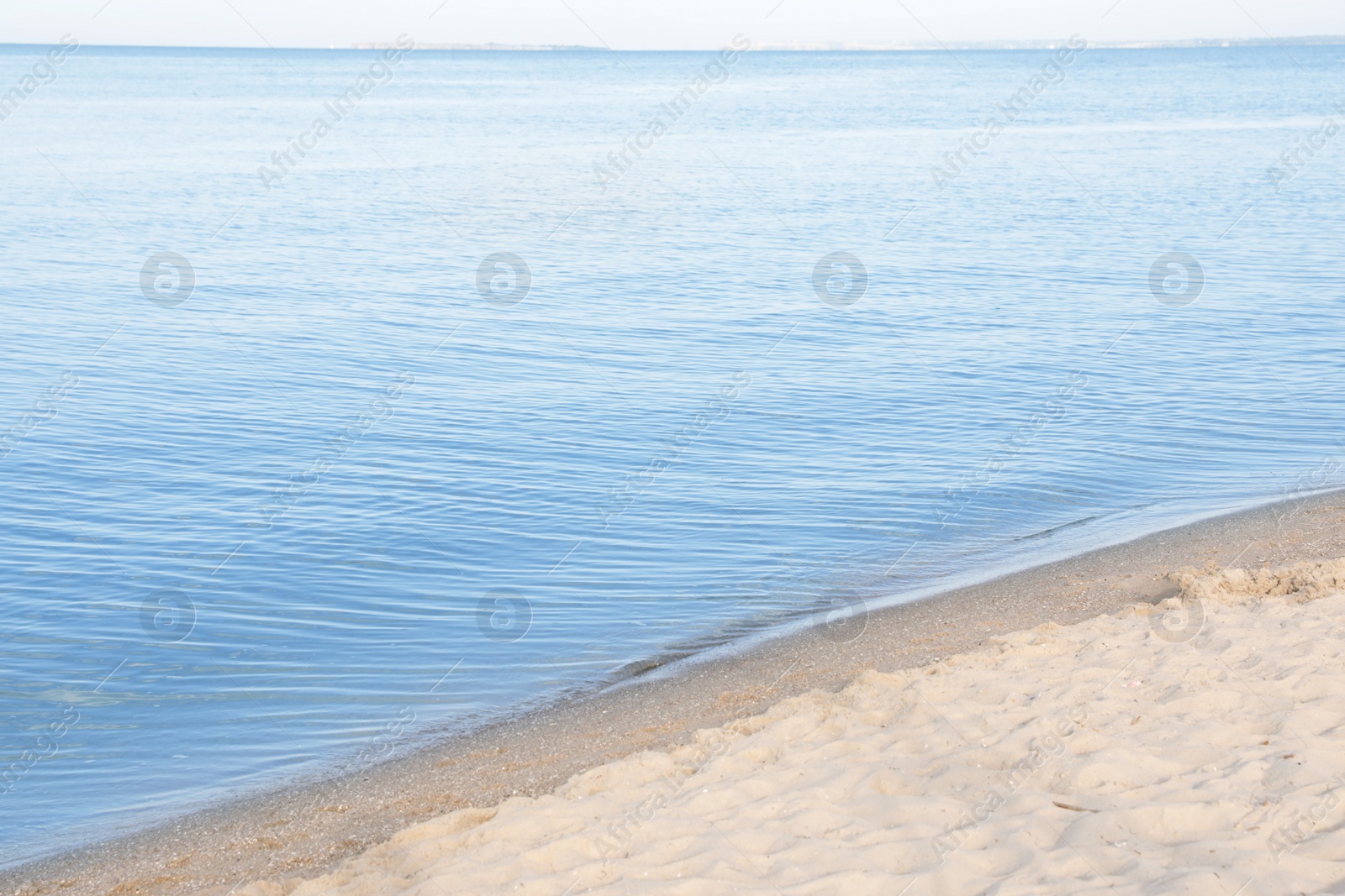 Photo of Sandy beach near sea on sunny day