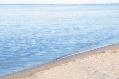 Photo of Sandy beach near sea on sunny day