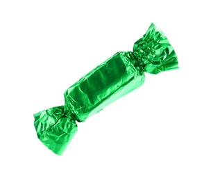 Tasty candy in green wrapper isolated on white