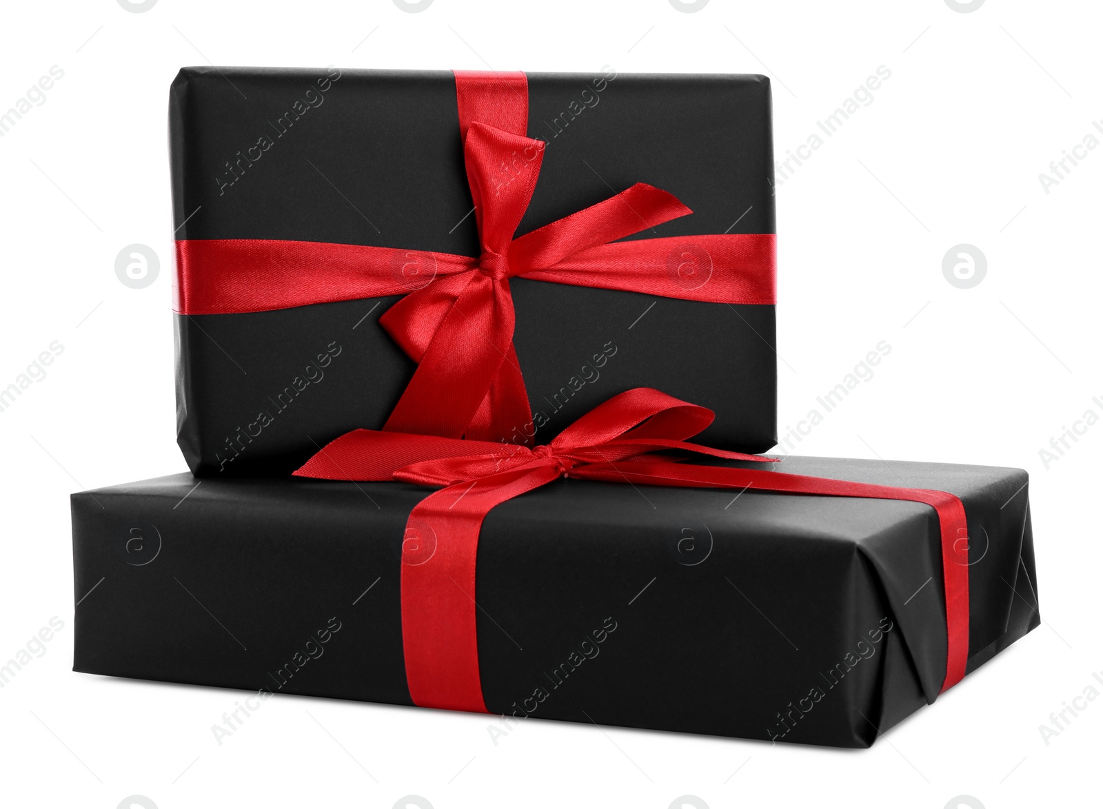 Photo of Black gift boxes with bows isolated on white