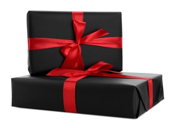 Black gift boxes with bows isolated on white