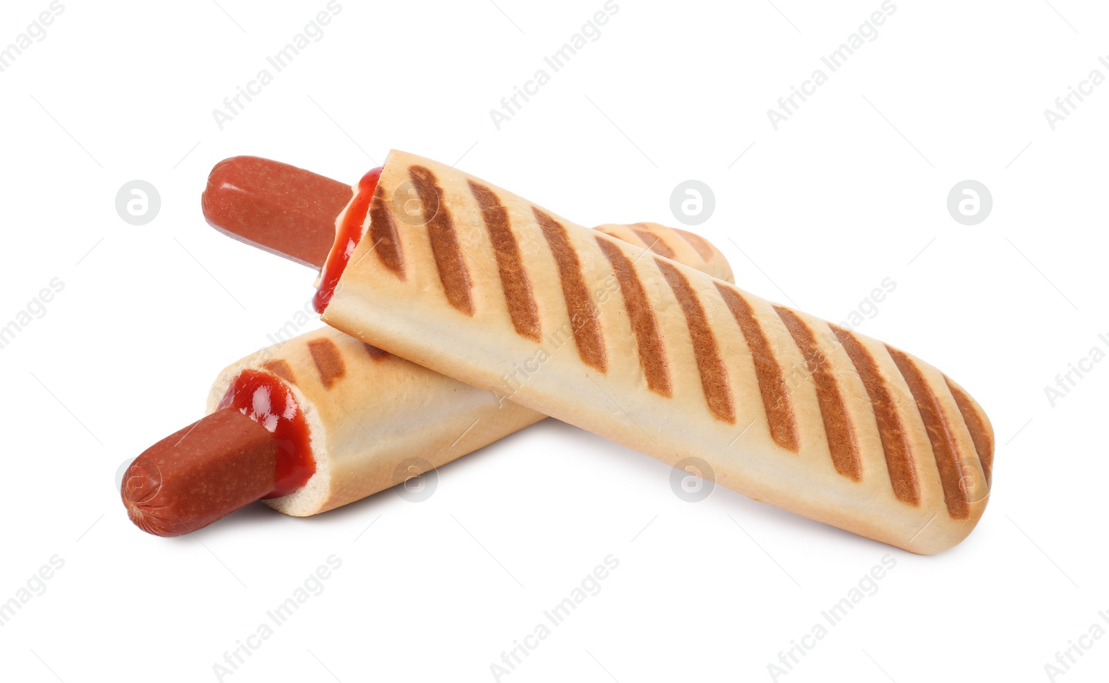 Photo of Tasty french hot dogs with sauce on white background