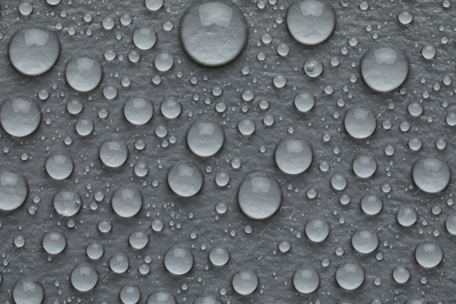 Photo of Water drops on grey background, top view