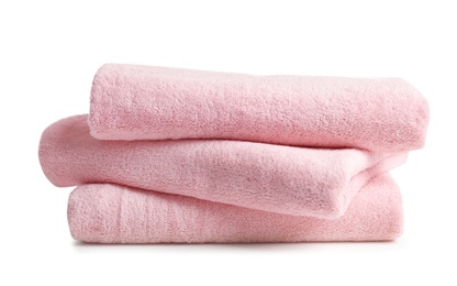 Stack of clean soft towels on white background