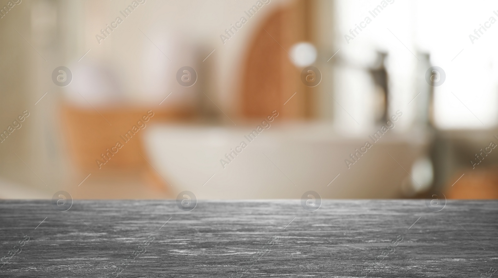 Image of Empty table and blurred view of stylish bathroom interior