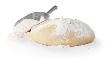 Photo of Raw dough and scoop with flour on white background