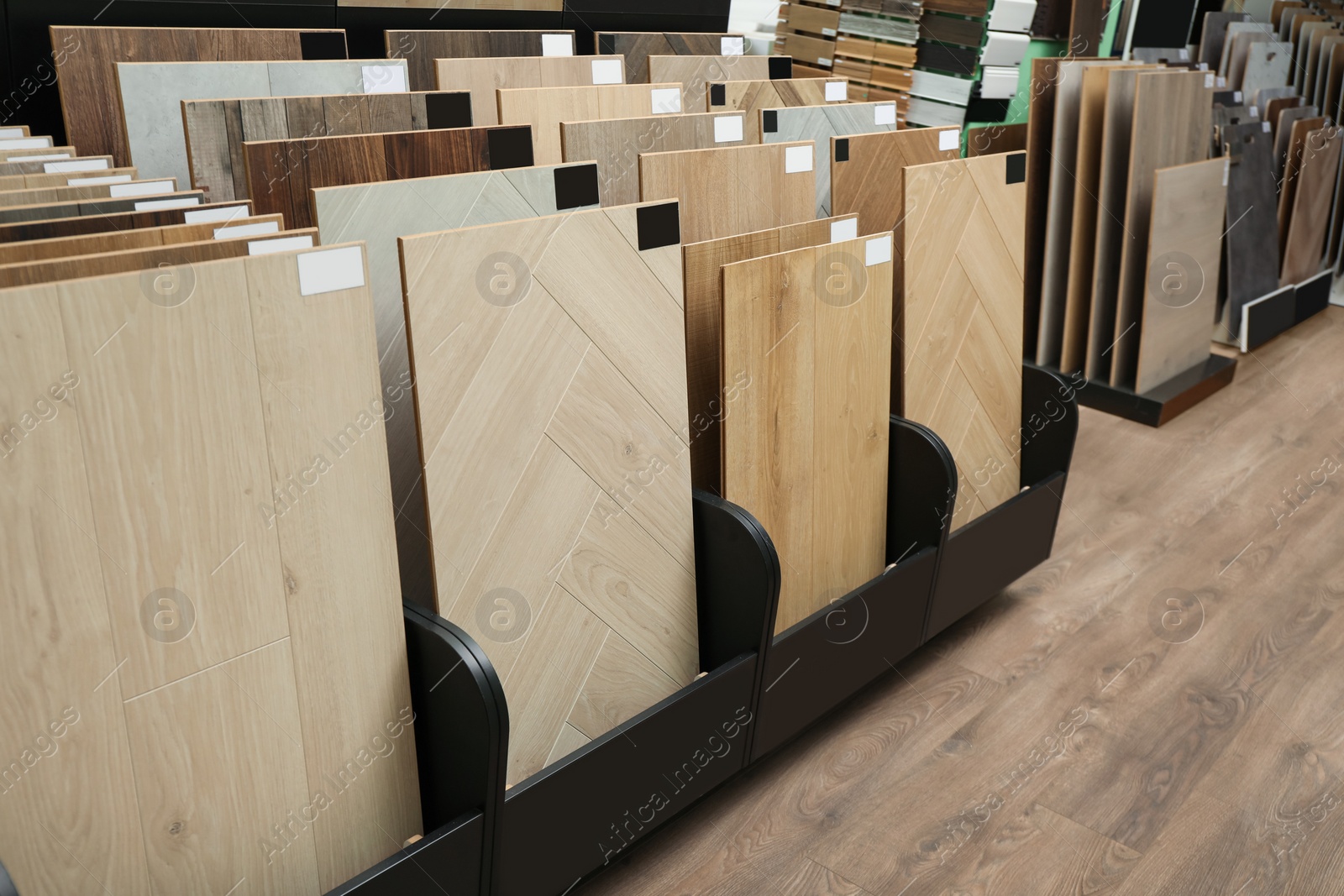 Photo of Many different samples of wooden flooring in store