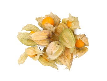 Photo of Many ripe physalis fruits with calyxes isolated on white, top view