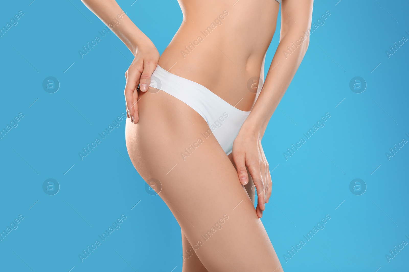 Photo of Slim young woman with smooth skin on color background, closeup. Beauty and body care concept