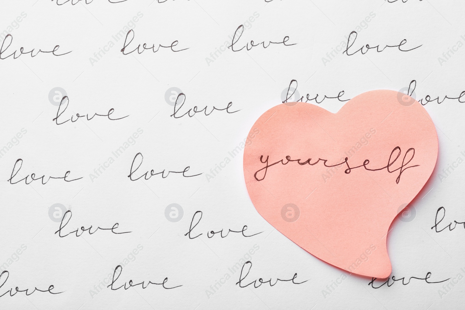 Photo of Composition with words LOVE YOURSELF and paper heart on white background, top view