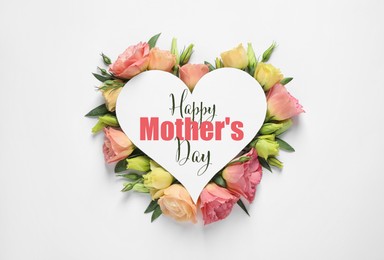 Image of Beautiful eustoma flowers and card with text Happy Mother's Day on white background, top view