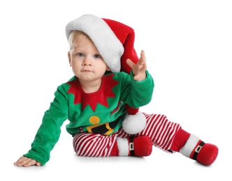 Photo of Cute baby in Santa's elf clothes sitting on white background. Christmas suit