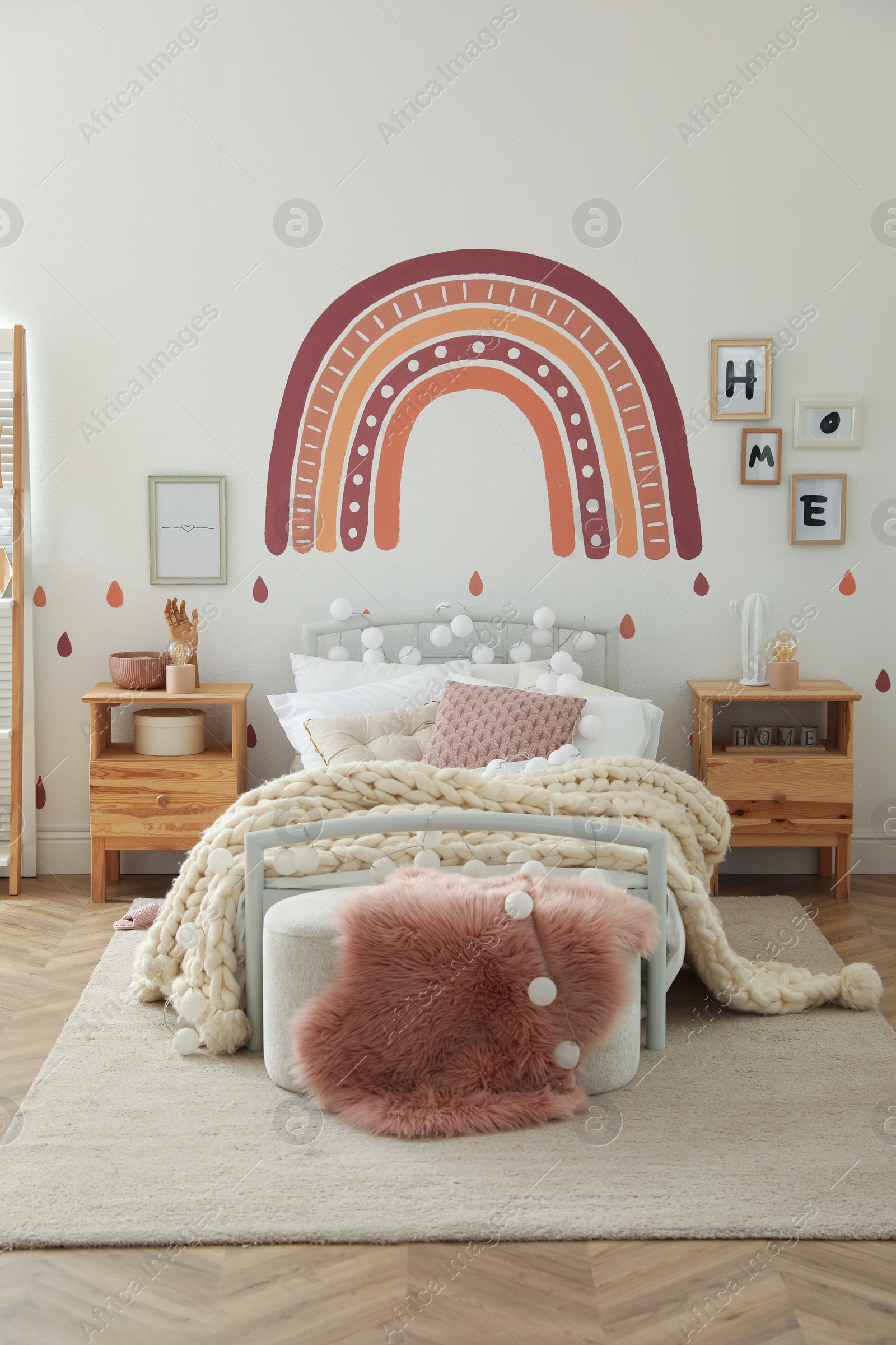 Photo of Stylish child's room interior with comfortable bed