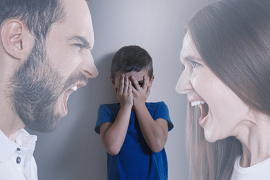 Image of Double exposure of sad little boy and his arguing parents