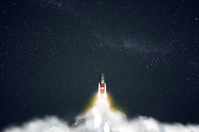 Image of Launched rocket in flight, night starry sky background. Space mission