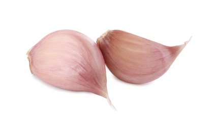 Photo of Fresh raw garlic cloves isolated on white