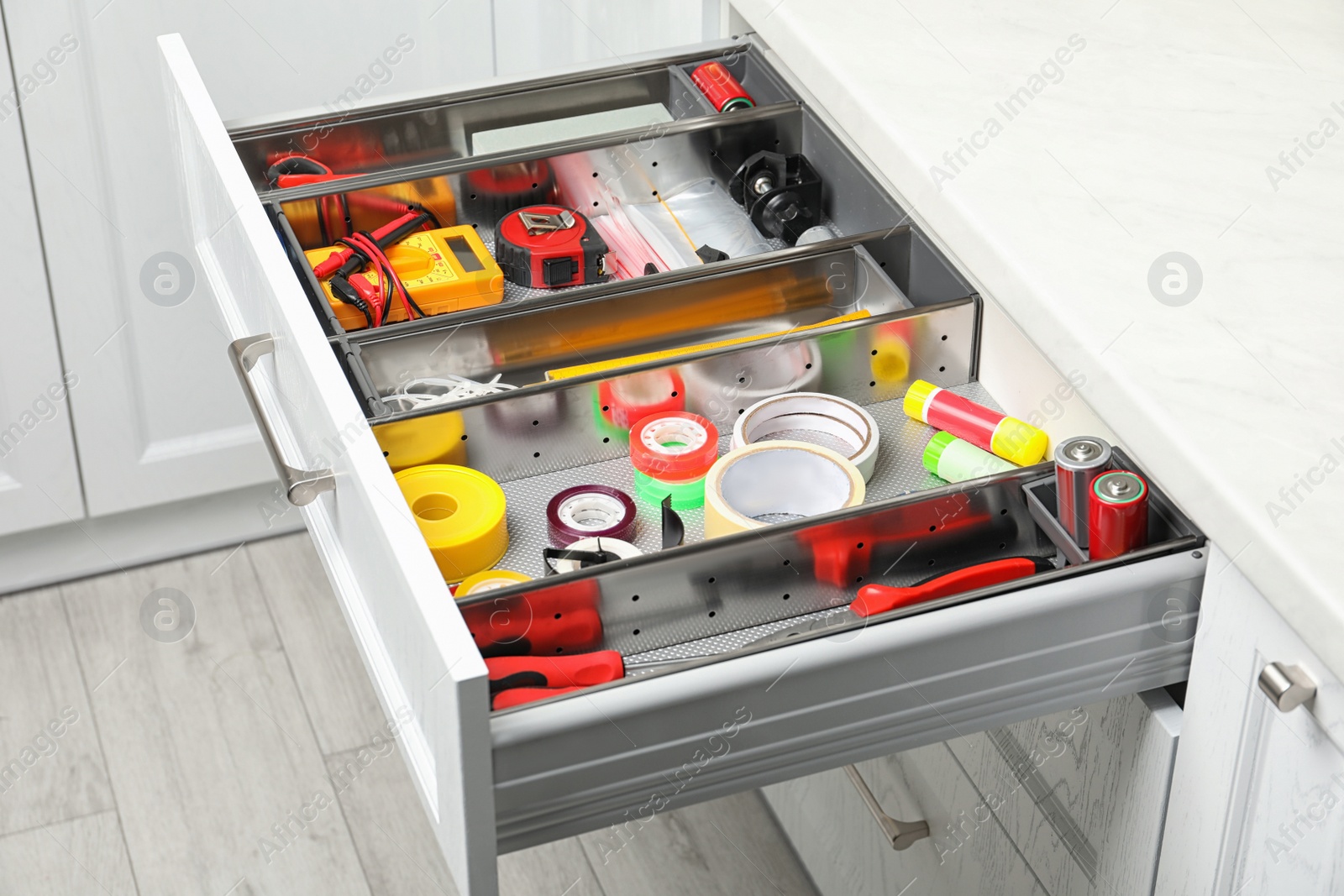 Photo of Set of instruments in open desk drawer indoors