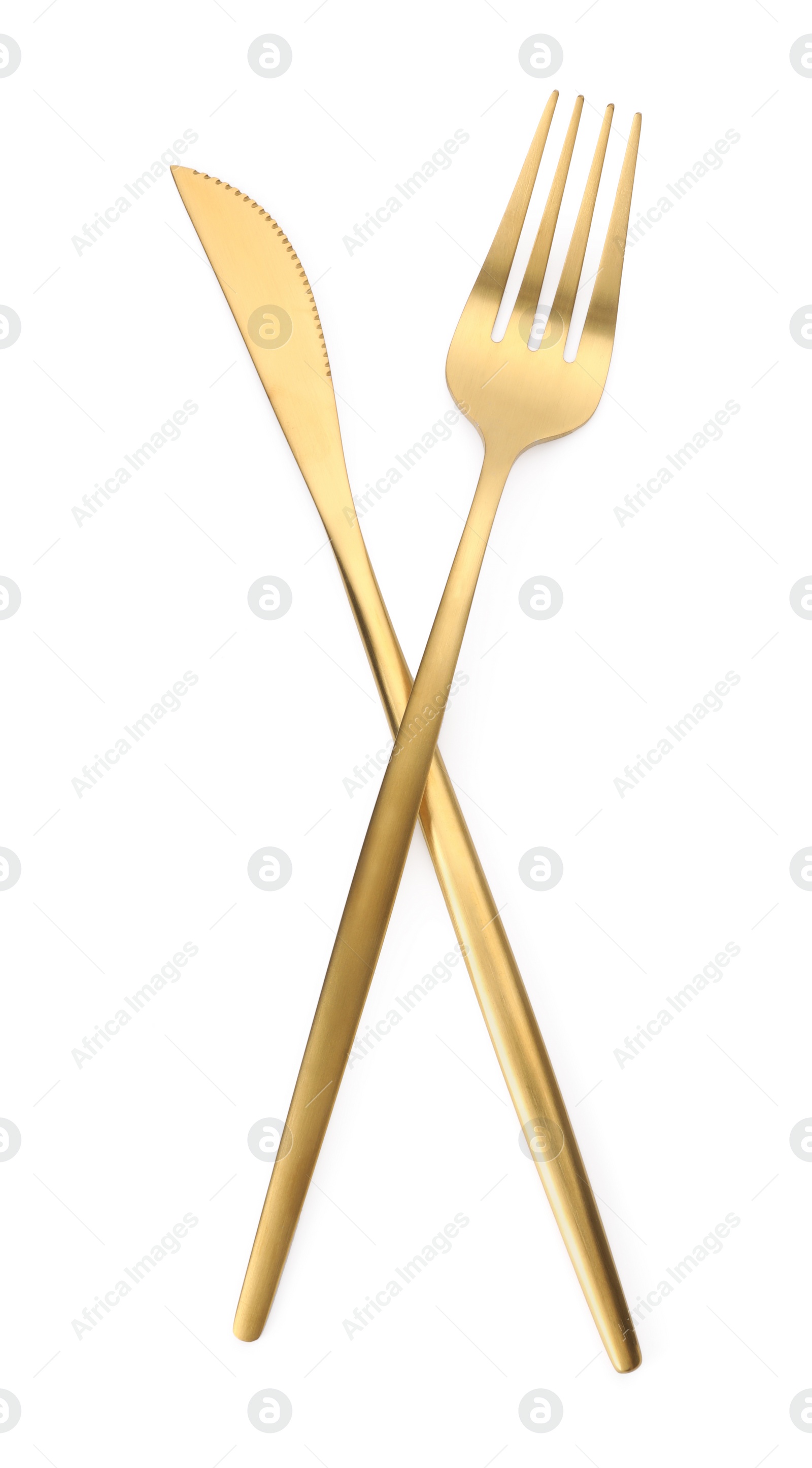 Photo of Shiny golden fork and knife isolated on white. Luxury cutlery