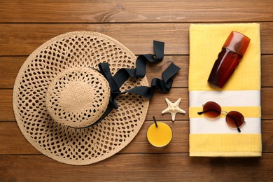 Flat lay composition with beach objects on wooden background