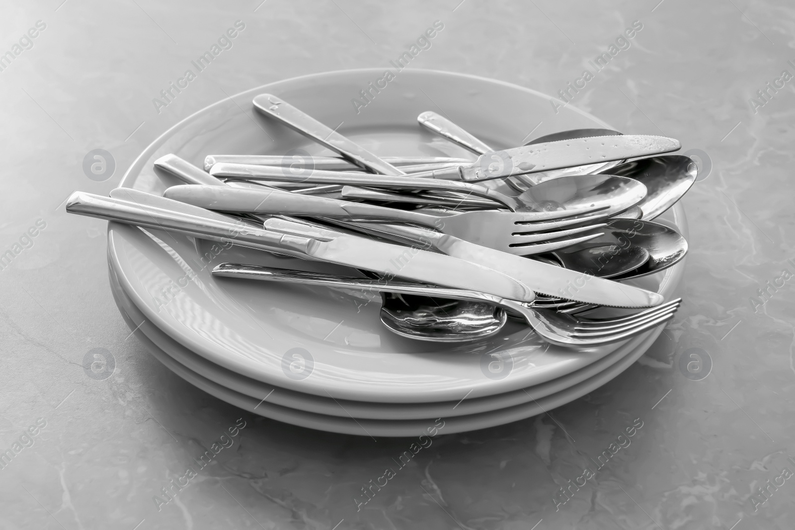 Photo of Different clean kitchenware on light grey marble table