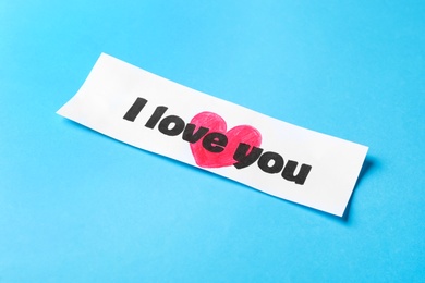 Card with text I Love You on light blue background