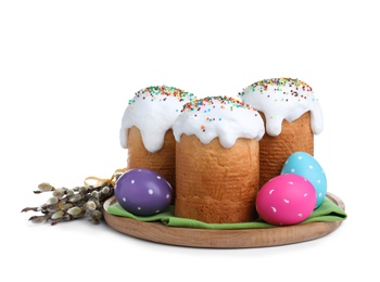 Photo of Traditional Easter cakes, pussy willows and colorful eggs on white background
