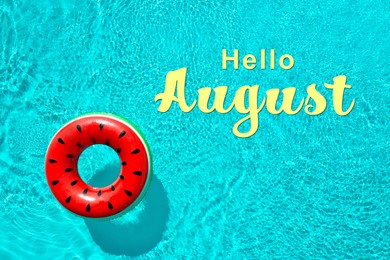 Image of Hello August. Inflatable ring floating in swimming pool, top view  