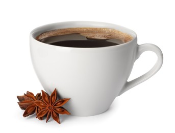 Cup of aromatic coffee with anise stars on white background