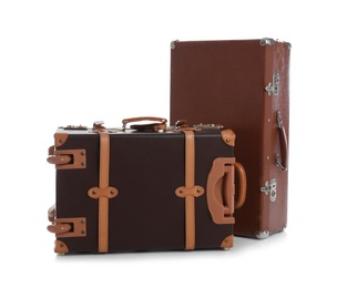 Photo of Set of classic suitcases on white background