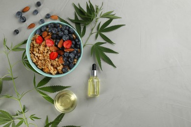 Photo of CBD oil, THC tincture, oatmeal bowl and hemp leaves on light grey table, flat lay. Space for text