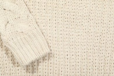 Texture of cozy warm sweater as background, closeup