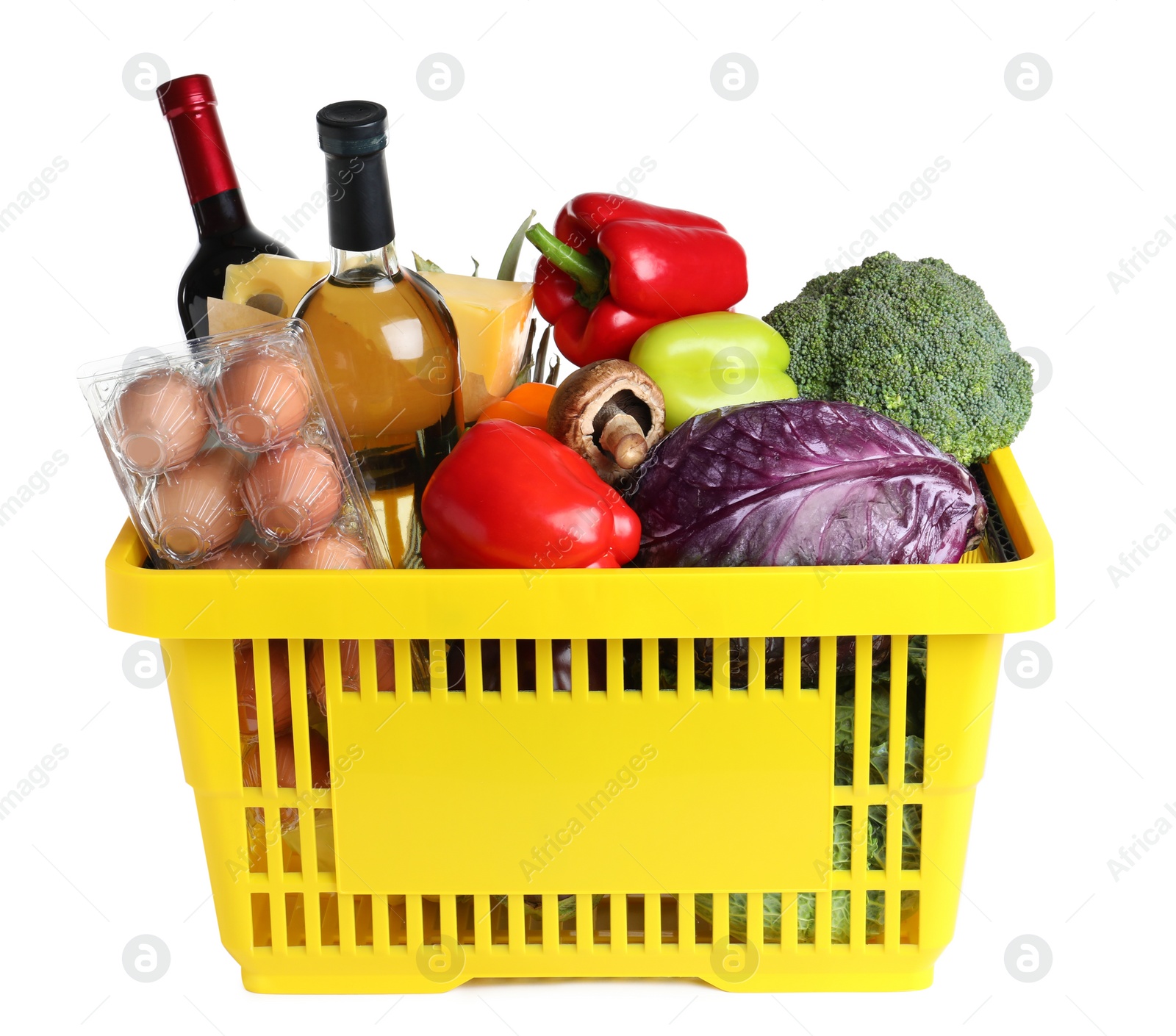 Photo of Shopping basket with grocery products on white background