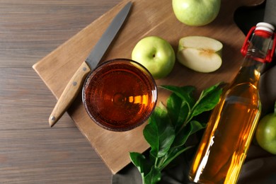 Photo of Flat lay composition with delicious apple cider on wooden table