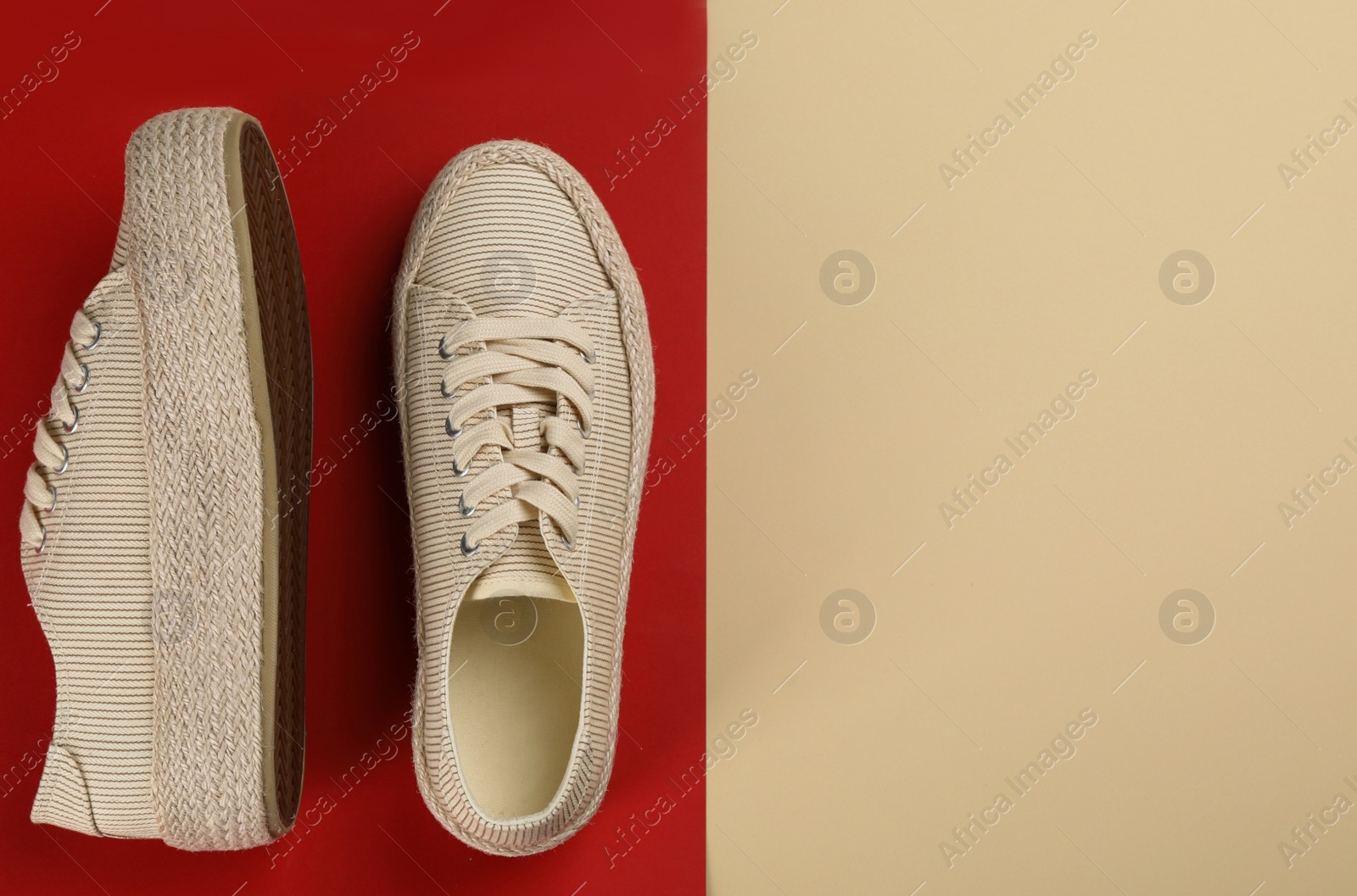 Photo of Pair of stylish sneakers on color background, flat lay. Space for text