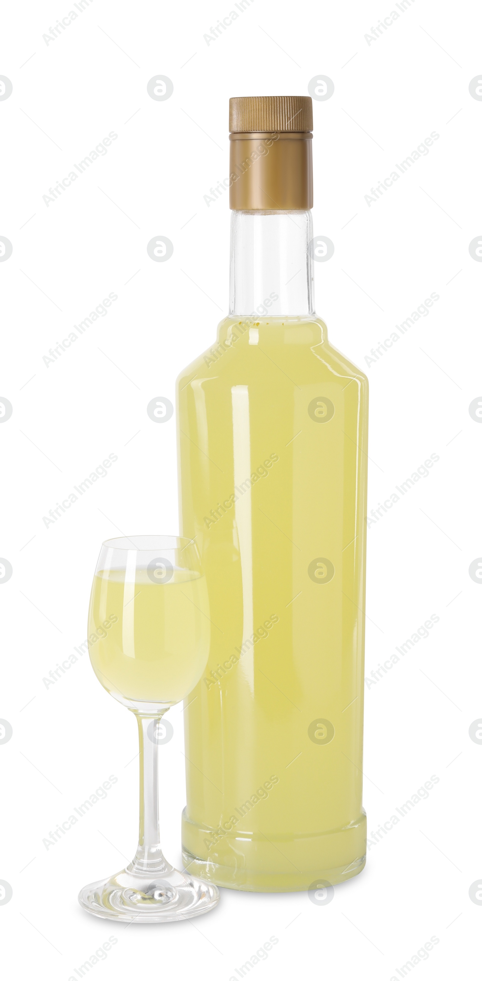 Photo of Bottle and glass with tasty limoncello liqueur isolated on white