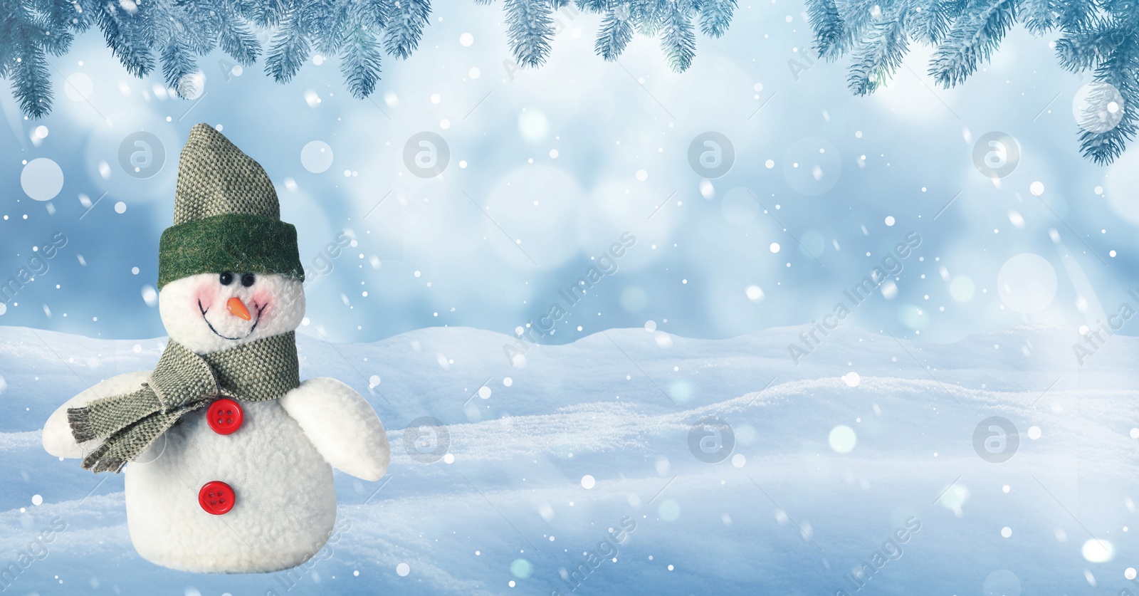 Image of Cute decorative snowman in hat and scarf outdoors on snowy day, space for text. Banner design