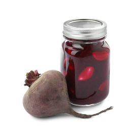 Photo of Pickled beets in glass jar and fresh vegetable isolated on white