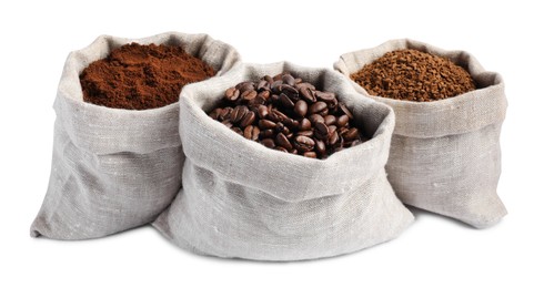 Bags with different types of coffee on white background