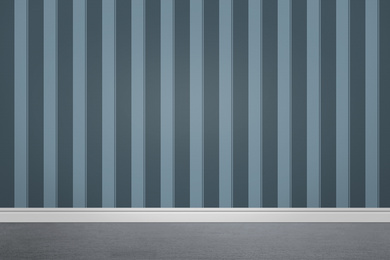 Image of Striped wallpaper and grey floor in room