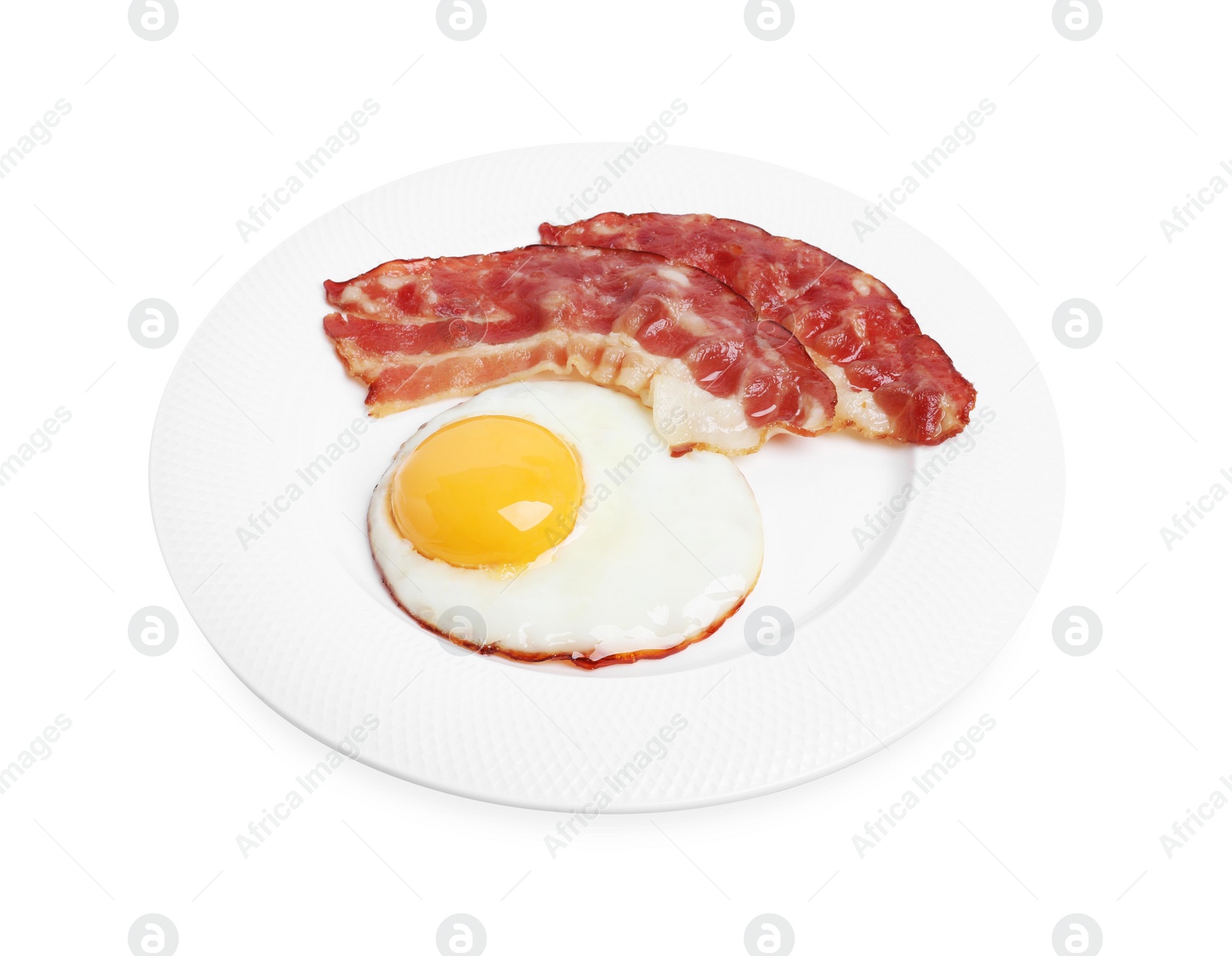 Photo of Plate with delicious fried egg and bacon isolated on white