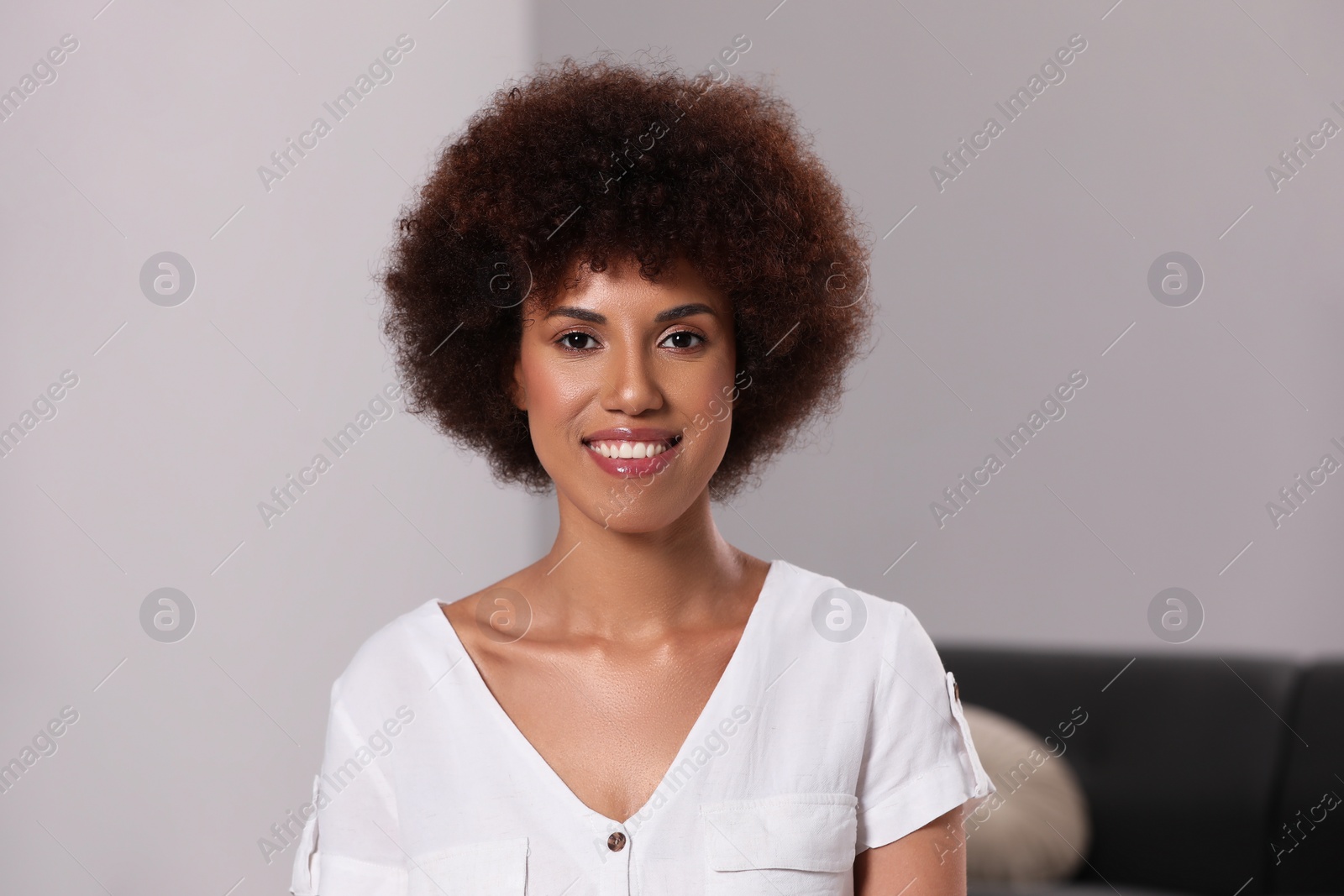 Photo of Portrait of beautiful young woman on light grey background